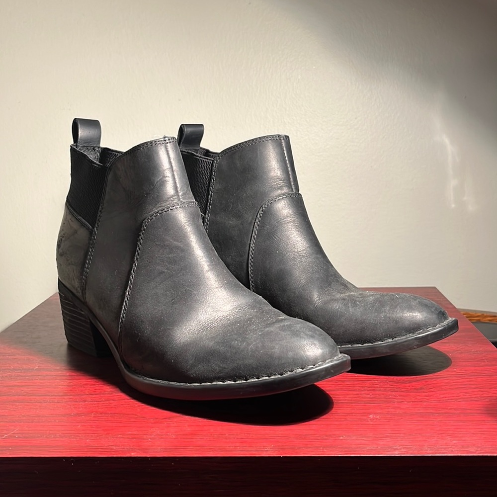 Born black waxy leather boots with a heel
